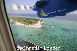 Seaplane coming in to land at the resort i work at. Landa... by Christian Loader 